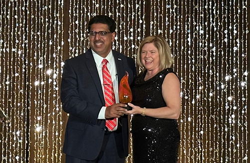 Rony Thomas accepting the Corporate Darden Award